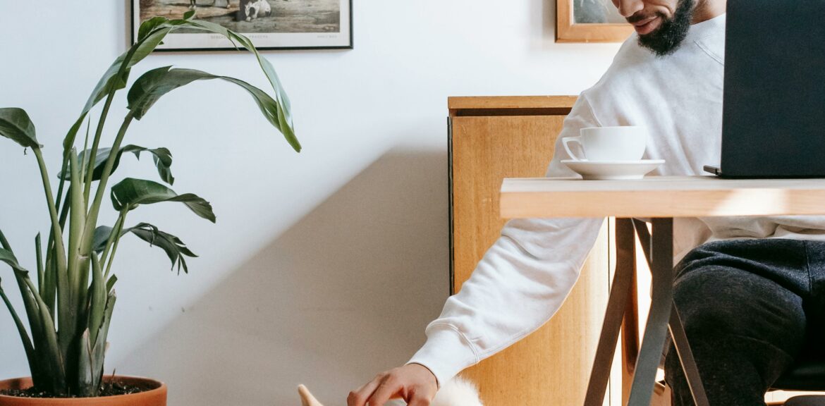 The Future of AI in Digital Marketing: 7 Smart Ways to Stay Ahead in 2025 A giy at his desk with his dog by his side